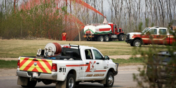 Looming fires are forcing thousands of Canadians to evacuate. Some may not return home until next week