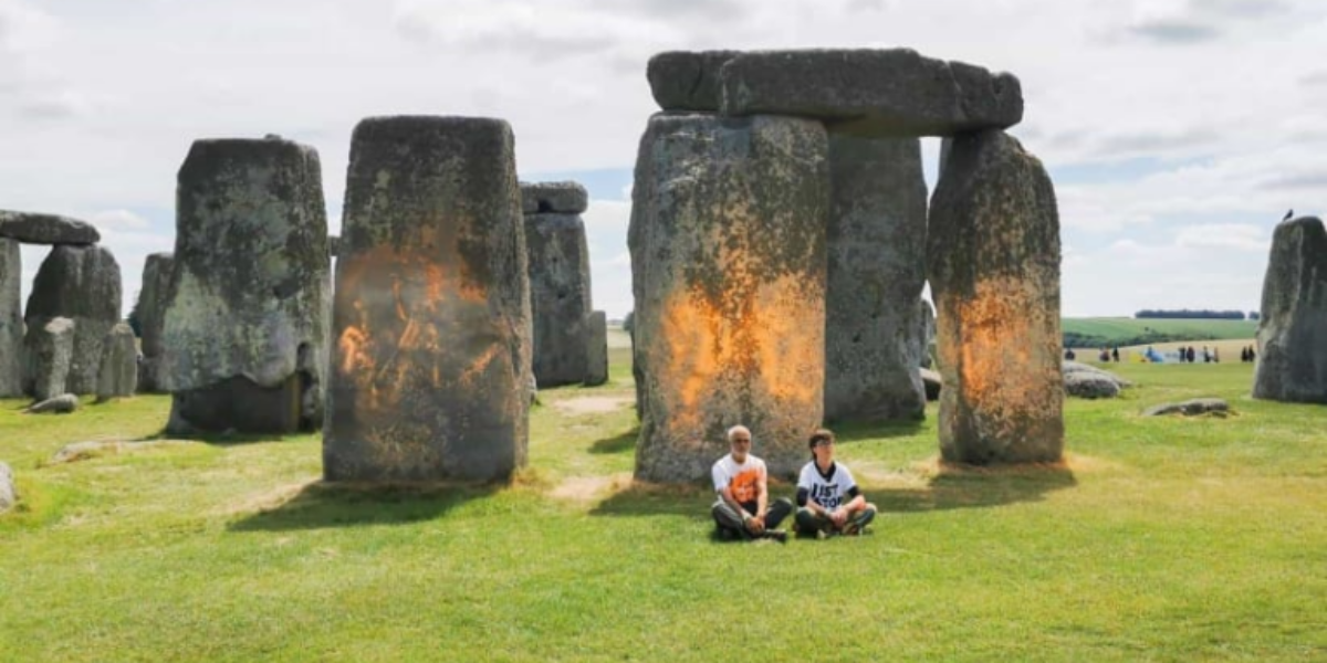 Two climate activists charged with spraying paint on UK’s Stonehenge