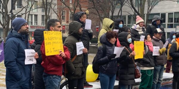 Immigrants take to the streets to protest against the freezing of immigration programmes