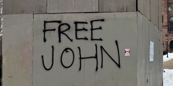 Man arrested after spray-painting ‘Free John’ outside enclosed statue of Canada’s first PM