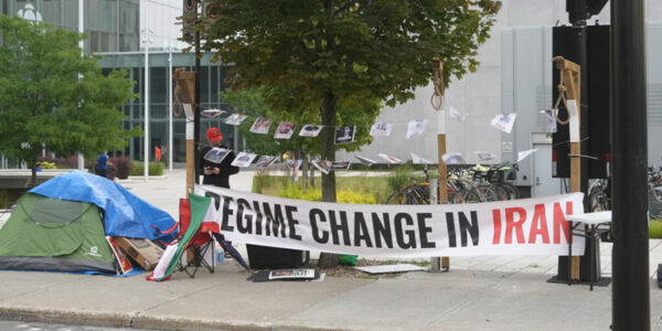 Activist protesting Iranian regime outside of Radio-Canada headquarters